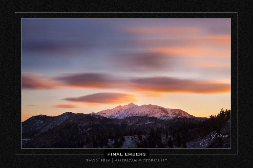 Final Embers - Pastel clouds drift by mount Nebo in Utah reflecting light onto the snow capped peaks.